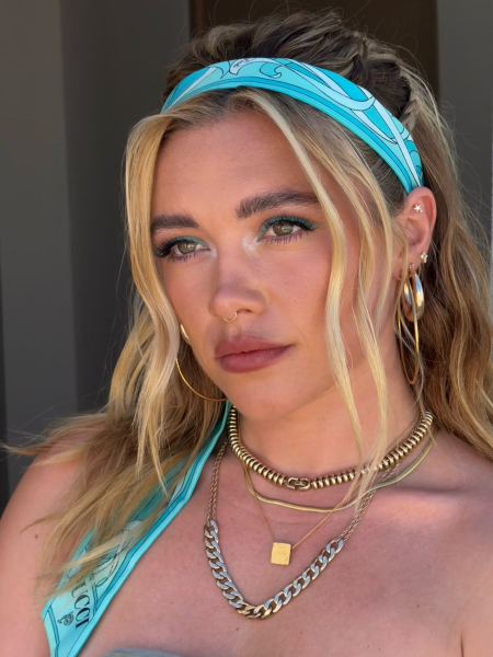 Florence Pugh posing in a blue Pucci headband